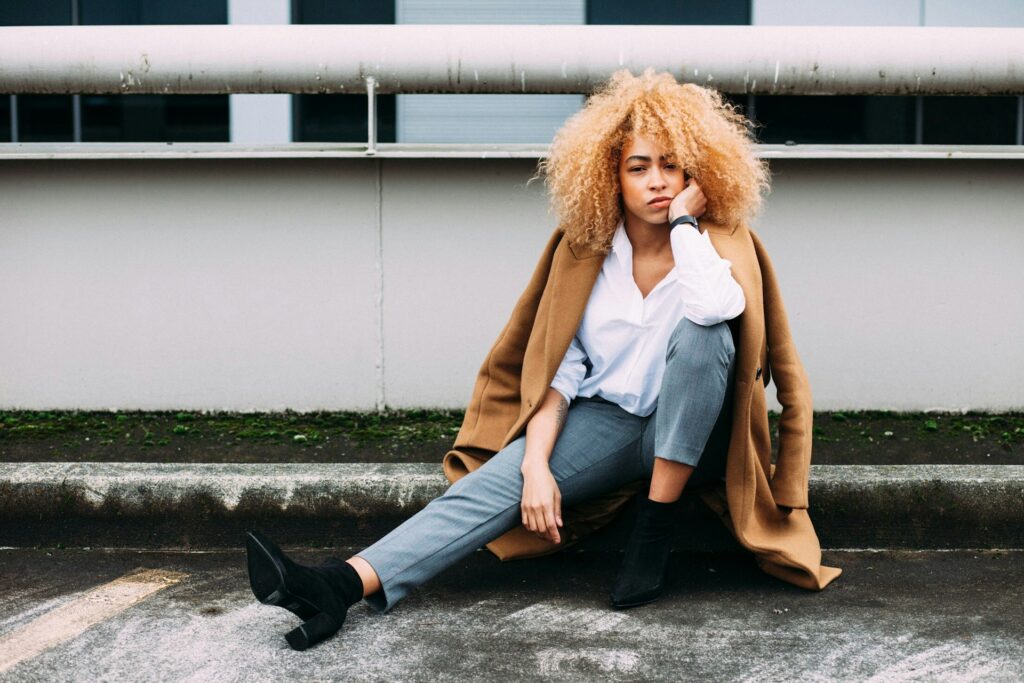 serious woman kneeling on corner