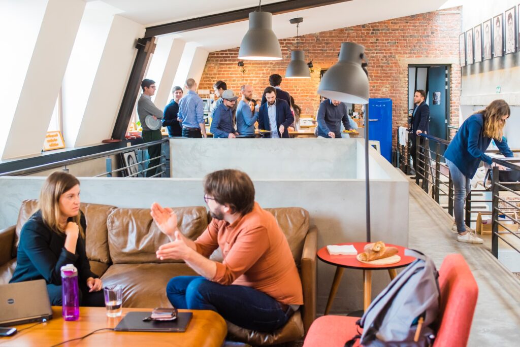 colleagues chatting in an open-plan office